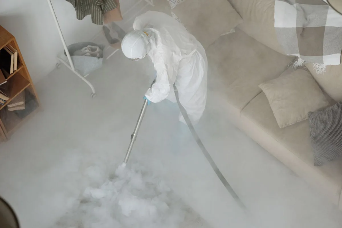Biohazard cleanup technician in protective equipment, Mill Plain, CT